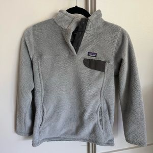 Like new grey with black trim Patagonia fleece size 12 large kids.